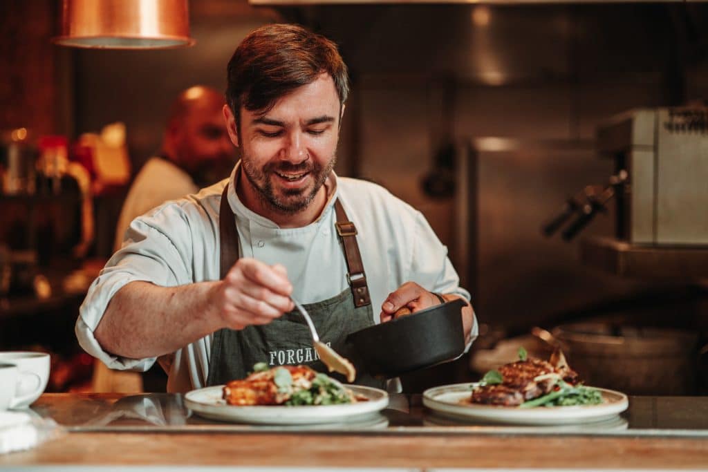 chef plating food at forgans